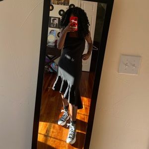 This is a midi length dress, never been worn and still is in good condition